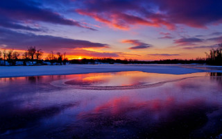 Sunset reflecting sky clouds frozen - the ground and trees free wallpaper