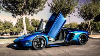 Blue sports car open parking - andrew law free wallpaper