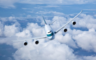 Large jetliner cloudy sky mountains - sky free wallpaper