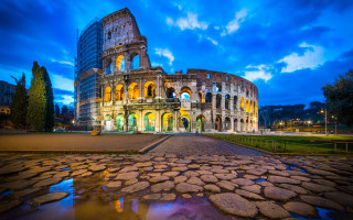 Large building tower waterfront night - a mosaic free wallpaper