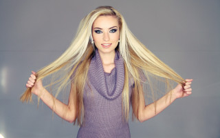 Blonde woman posing ponytail blue - a pony tail free wallpaper