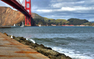 Bridge waterboats mountains scenery sunset - the water below free wallpaper