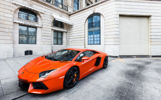 Bright orange sports car building - the side of the building free wallpaper