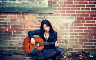 Woman guitar brick wall portrait - aileen eagleton free wallpaper