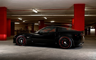 Black sports car red pillars - a parking garage free wallpaper