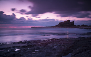 Castle rocky shore purple sky - rich moody colour free wallpaper