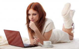 Woman laying laptop coffee blanket - detail free wallpaper