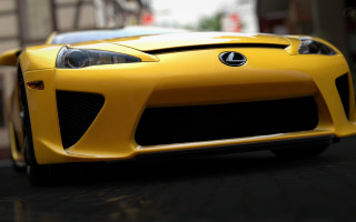 Yellow sports car street building 2 - a yellow sports car free wallpaper