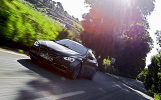 Black car road trees bushes - a black car free wallpaper