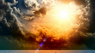 Bright sun clouds ocean boat 2 - the water below free wallpaper