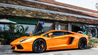 Bright orange sports car building 3 - vibrant color free wallpaper