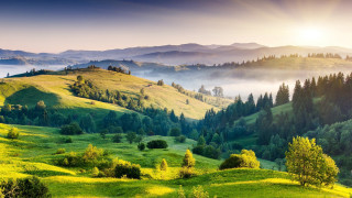 Green valley mountains sun fog 2 - a green valley free wallpaper