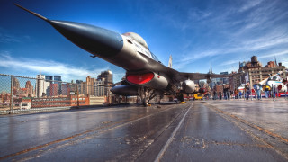 Jet plane runway city skyline - a jet plane free wallpaper