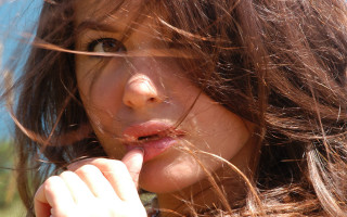 Woman blowing hair cigarette portrait 2 - her mouth free wallpaper