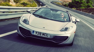 White sports car hillside roadsign - face free wallpaper