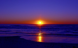 Sunset ocean beach sky waves - a sunset over the ocean free wallpaper