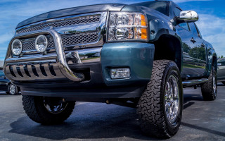 Large truck big tire parking - a parking lot free wallpaper