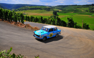 Blue car dirt road green - small free wallpaper