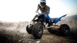 Mountain man riding blue quad - a dirt road free wallpaper