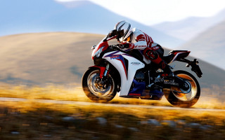 Motorcycle rider mountains grass blurry - a person riding free wallpaper