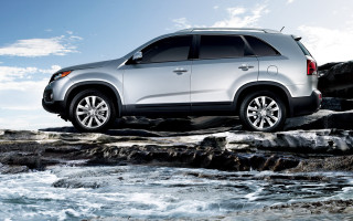 Silver suv rocky shore river - a silver suv free wallpaper
