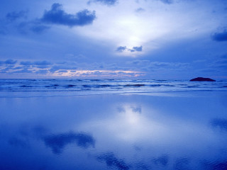 Blue sky clouds island ocean - a small island in the distance free wallpaper