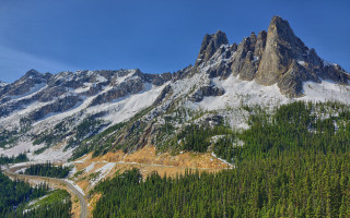 Mountain road forest snow tilt - a forest below free wallpaper