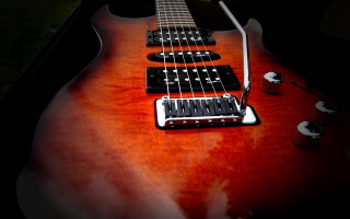 Guitar red black white pickup - a close up of a guitar free wallpaper