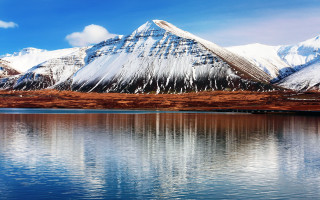 Mountain lake reflection snowy horizon - evaline ness free wallpaper