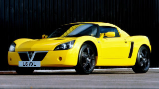 Yellow sports car black wall - a yellow sports car free wallpaper