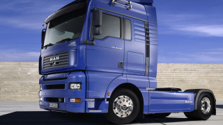 Blue semi truck parking lot - a blue sky free wallpaper