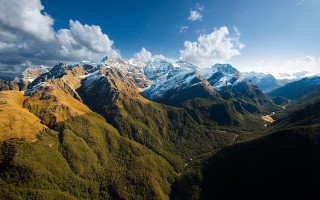 Mountain range valley river clouds 2 - a valley below free wallpaper