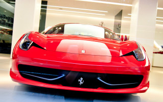 Red sports car showroom white 2 - a white wall behind free wallpaper