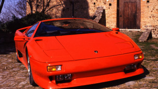 Red sports car brick building 3 - a window open free wallpaper