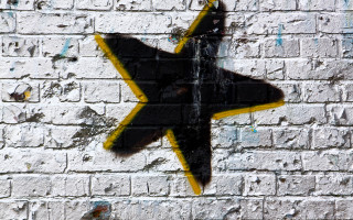 Yellow black star brick wall - bill traylor free wallpaper
