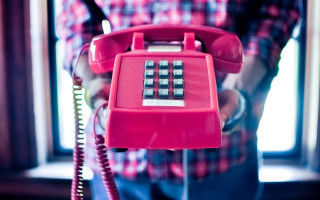 Person red phone cord abstract - a cord free wallpaper