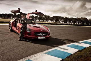 Woman red sportscar open doors - a race track free wallpaper