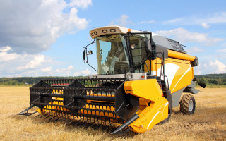 Yellow tractor wheat field precisionism - heavy grain free wallpaper