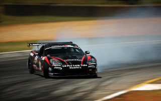 Car race track smoke exhaust - a race track free wallpaper