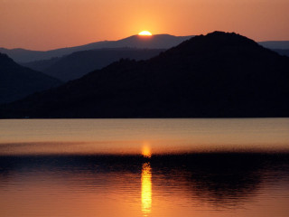 Sunset mountain lake island dusk - a small island in the distance free wallpaper