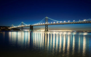 Night bridge city lights water 4 - side and a city in the background free wallpaper