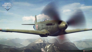 Green airplane flying mountain range 3 - over a mountain range in the sky free wallpaper