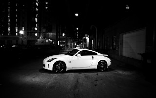 White sports car night city 11 - night time in a city free wallpaper