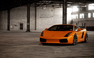 Bright orange sports car parking - a large window free wallpaper