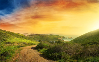 Dirt road green hillside lake - a dirt road free wallpaper