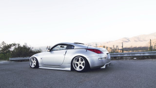 Silver sports car mountain road 8 - the side of a road near a mountain range free wallpaper