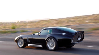Black sports car hillside road - a hillside free wallpaper