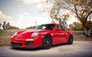 Red sports car autumn leaves - redshift free wallpaper