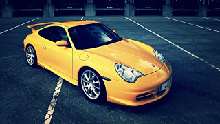 Yellow sports car night sky 4 - a parking lot free wallpaper