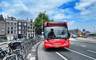 Red bus street bikes cityscape - the side of the road free wallpaper